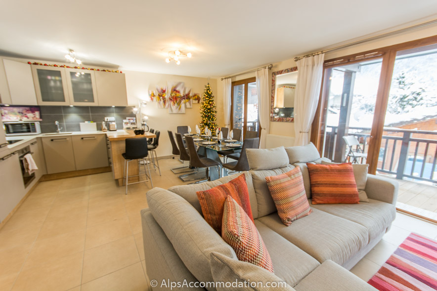 Le Clos F6 Samoëns - Stunning open plan living kitchen and dining areas with the balcony beyond