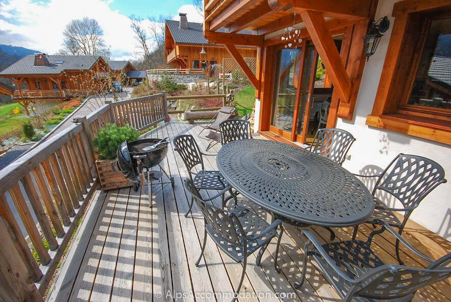 Apartment Biollet Samoëns - Sunny, south facing terrace with table and chairs, parasol, deck chairs and BBQ
