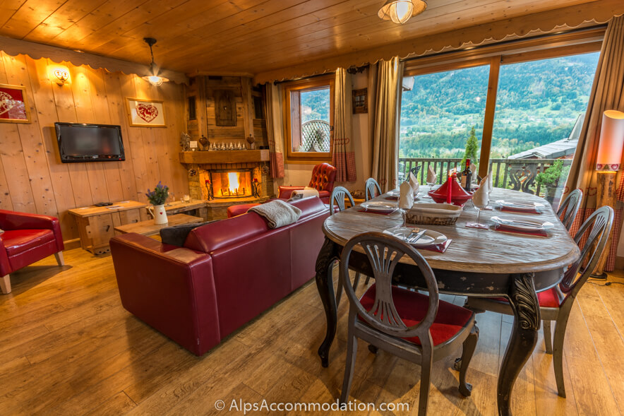Apartment Biollet Samoëns - Open plan living and dining area with log fire and stunning views to the pistes of the Grand Massif ski area