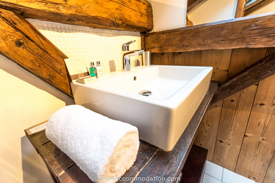 The Mazot Samoëns - The gorgeous master bedroom ensuite contains beautiful wood and rustic beams