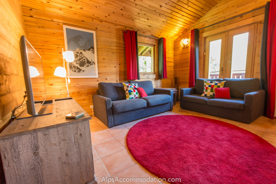 Chalet Booboo Morillon - Cosy living area with log burner and large LCD TV with satellite receiver