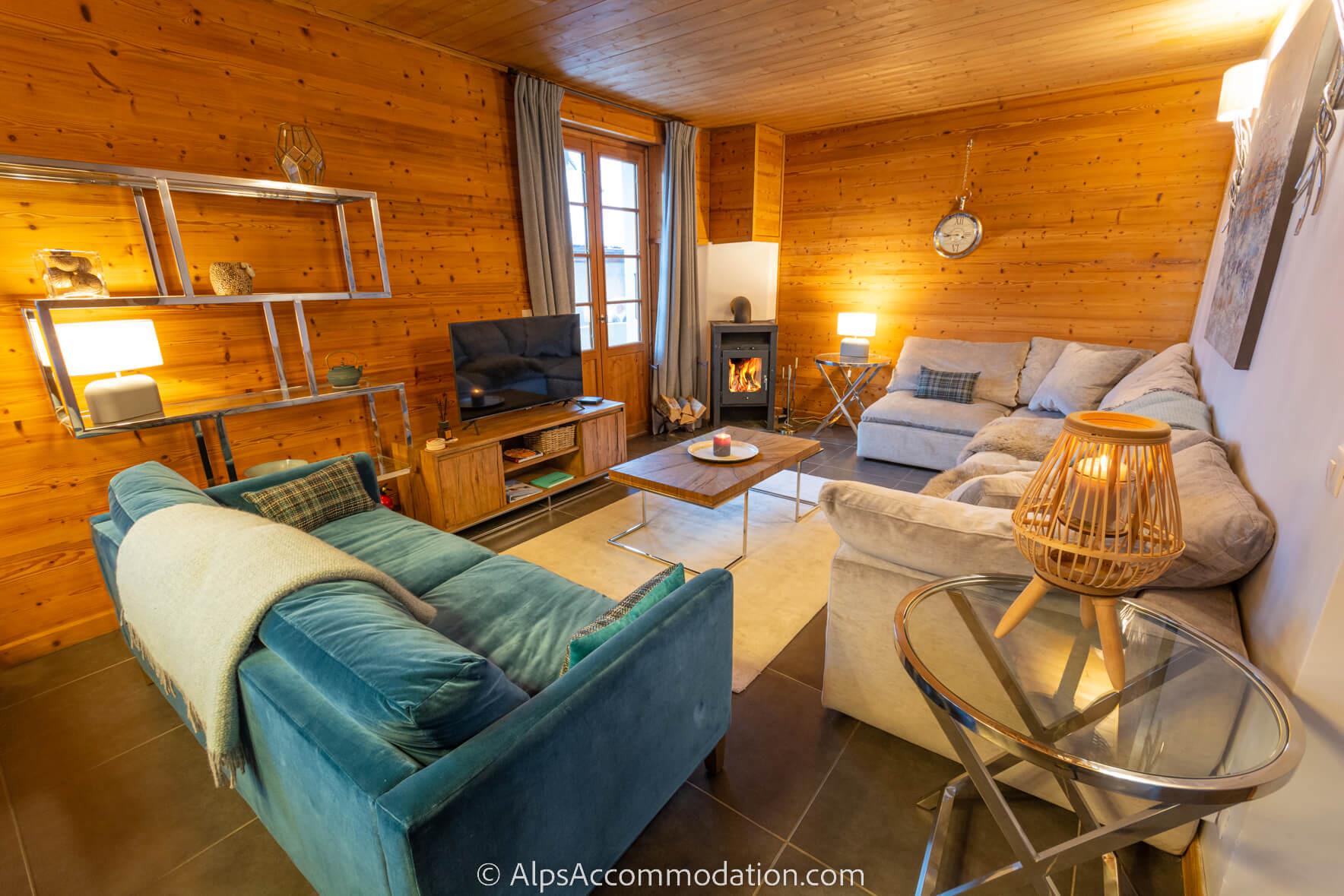 La Maison Blanche Samoëns - Cosy living area with log burner, TV and deep comfortable sofas