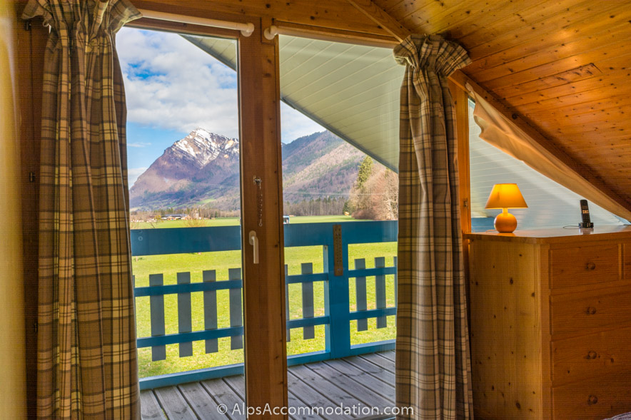 Chalet Bleu Morillon - The upper ensuite king bedroom gives wonderful views over open farmland and towering peaks